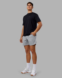 Man wearing 1% Better Value Series FLXCotton Tee Oversize - Black-Black | Model:Jackson | Size:L