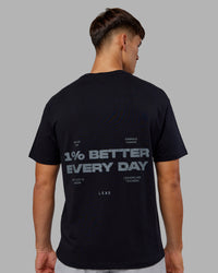 Man wearing 1% Better Value Series FLXCotton Tee Oversize - Black-Black | Model:Jackson | Size:L