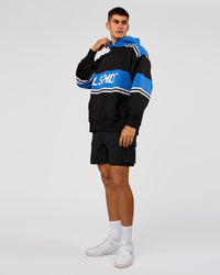 Man wearing A-Team Oversized Hoodie - Caviar-Palace Blue | Model:Jackson | Size:L