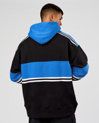 Man wearing A-Team Oversized Hoodie - Caviar-Palace Blue | Model:Jackson | Size:L