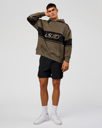 Man wearing A-Team Oversized Hoodie - Walnut Grey-Caviar | Model:Jackson | Size:L