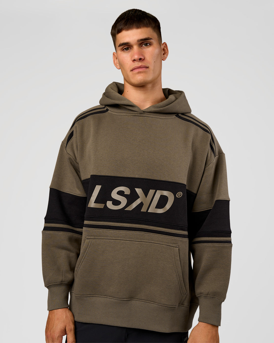 Man wearing A-Team Oversized Hoodie - Walnut Grey-Caviar | Model:Jackson | Size:L