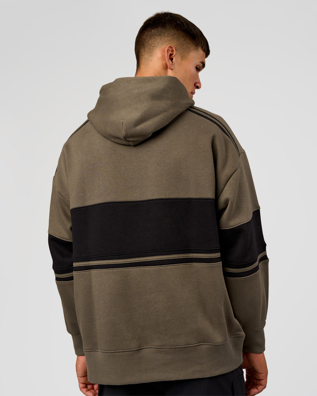 Man wearing A-Team Oversized Hoodie - Walnut Grey-Caviar | Model:Jackson | Size:L