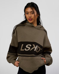 Woman wearing 
A-Team Oversized Hoodie - Walnut Grey-Caviar | Model:Loren | Size:L