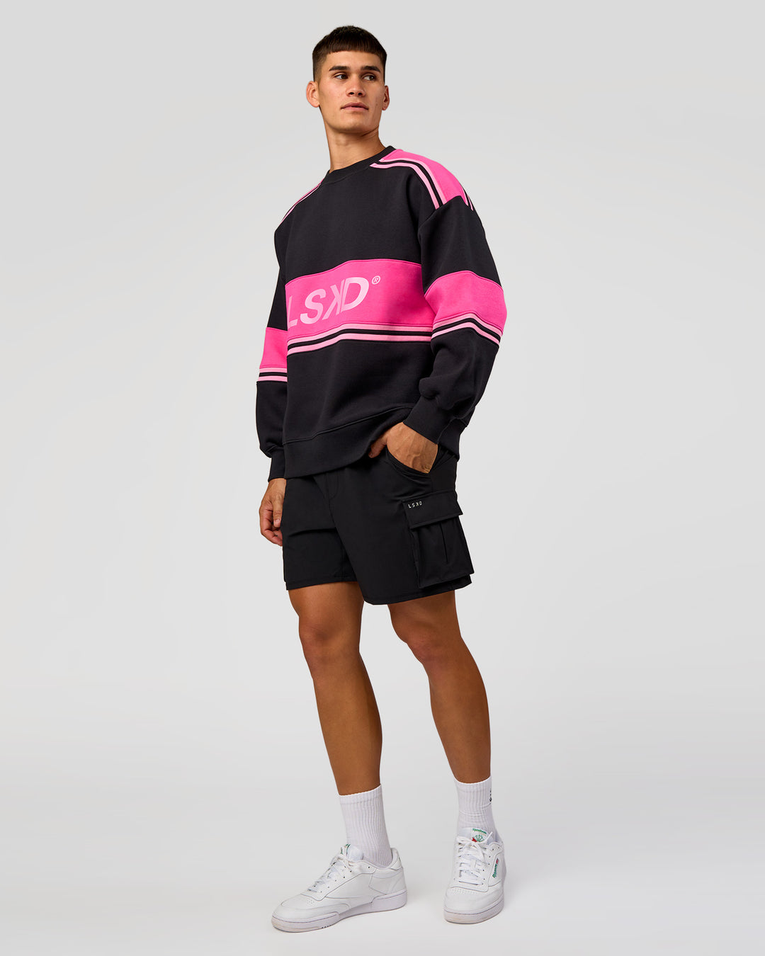 Man wearing A-Team Sweater Oversize - Caviar-Ultra Pink-Candy Pink | Model:Jackson | Size:L