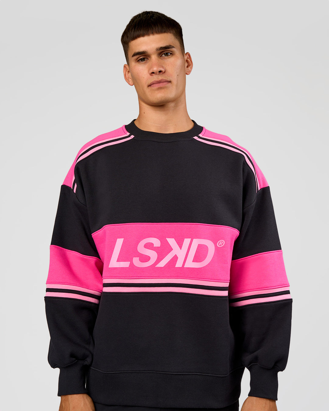 Man wearing A-Team Sweater Oversize - Caviar-Ultra Pink-Candy Pink | Model:Jackson | Size:L