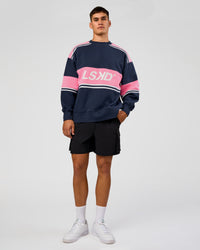 Man wearing A-Team Sweater Oversize - Future Navy-Candy Pink | Model:Jackson | Size:L