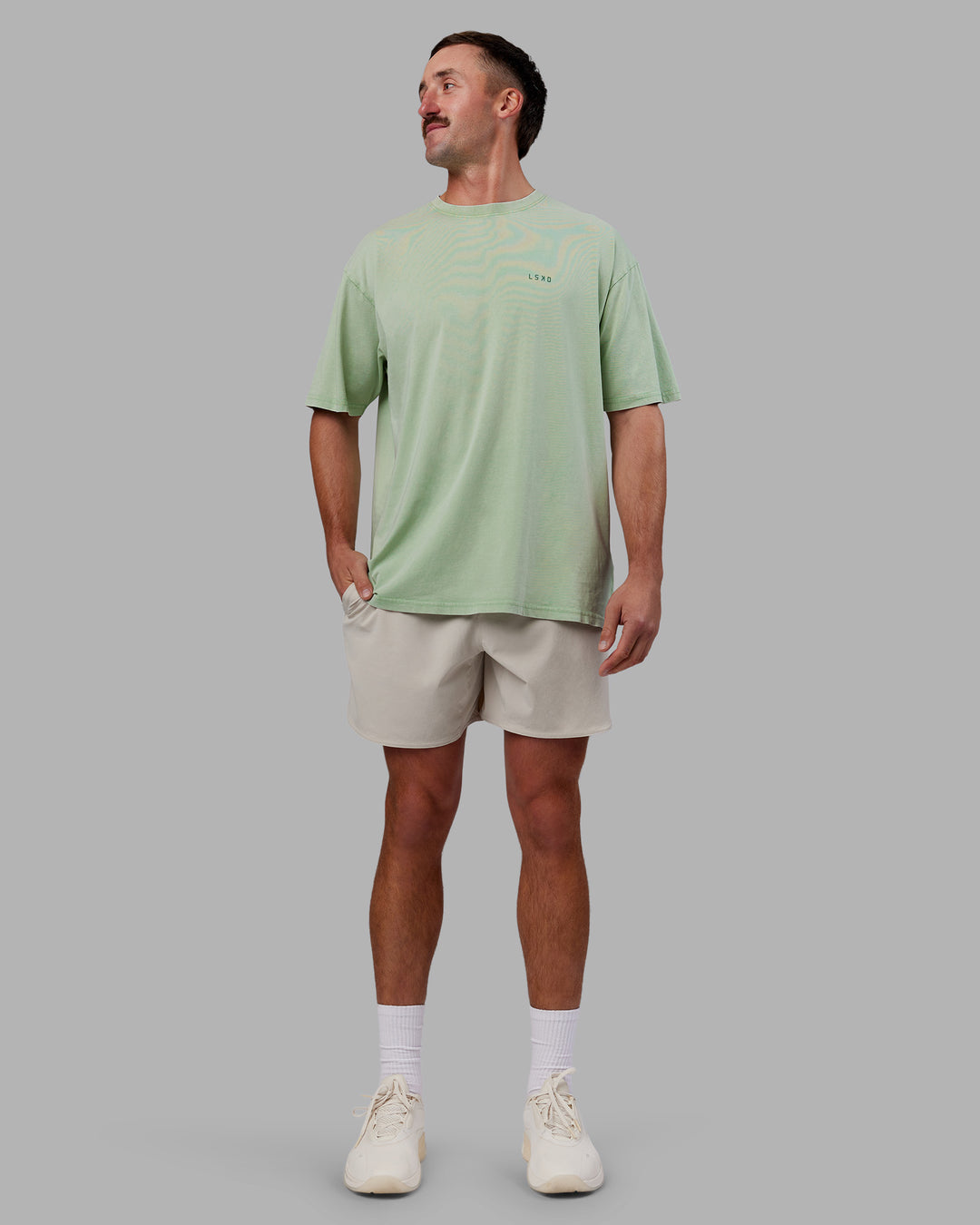 Man wearing Abs Unisex Growth FLXCotton Oversized Tee - Matcha Green Washed | Model:Fletcher | Size:L