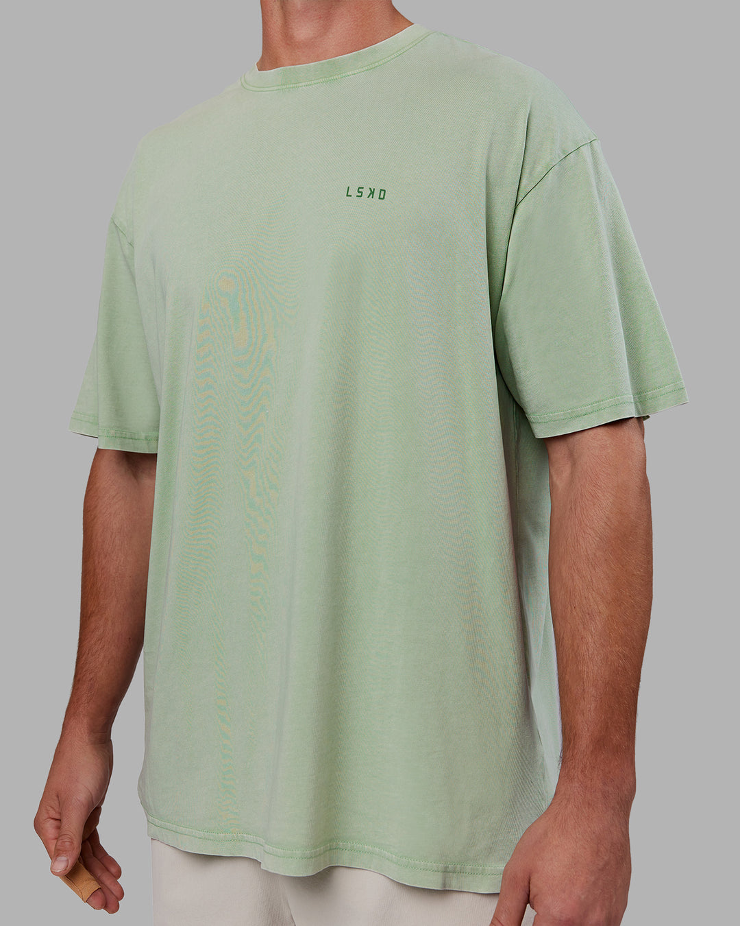 Man wearing Abs Unisex Growth FLXCotton Oversized Tee - Matcha Green Washed | Model:Fletcher | Size:L