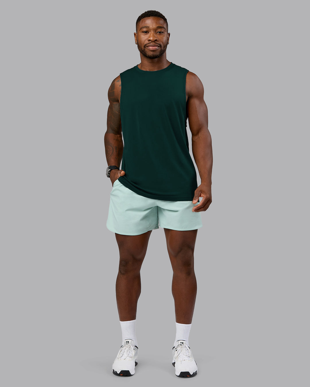 Man wearing AeroFLX+ Seamless Muscle Tank - Dark Moss/Dark Moss Marl | Model:Sam | Size:L