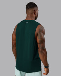 Man wearing AeroFLX+ Seamless Muscle Tank - Dark Moss/Dark Moss Marl | Model:Sam | Size:L