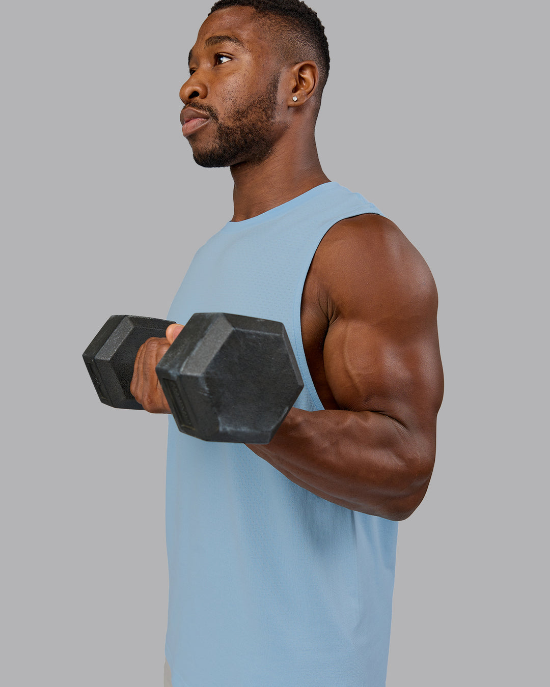 Man wearing AeroFLX+ Seamless Muscle Tank - Glacial Blue | Model:Sam | Size:L