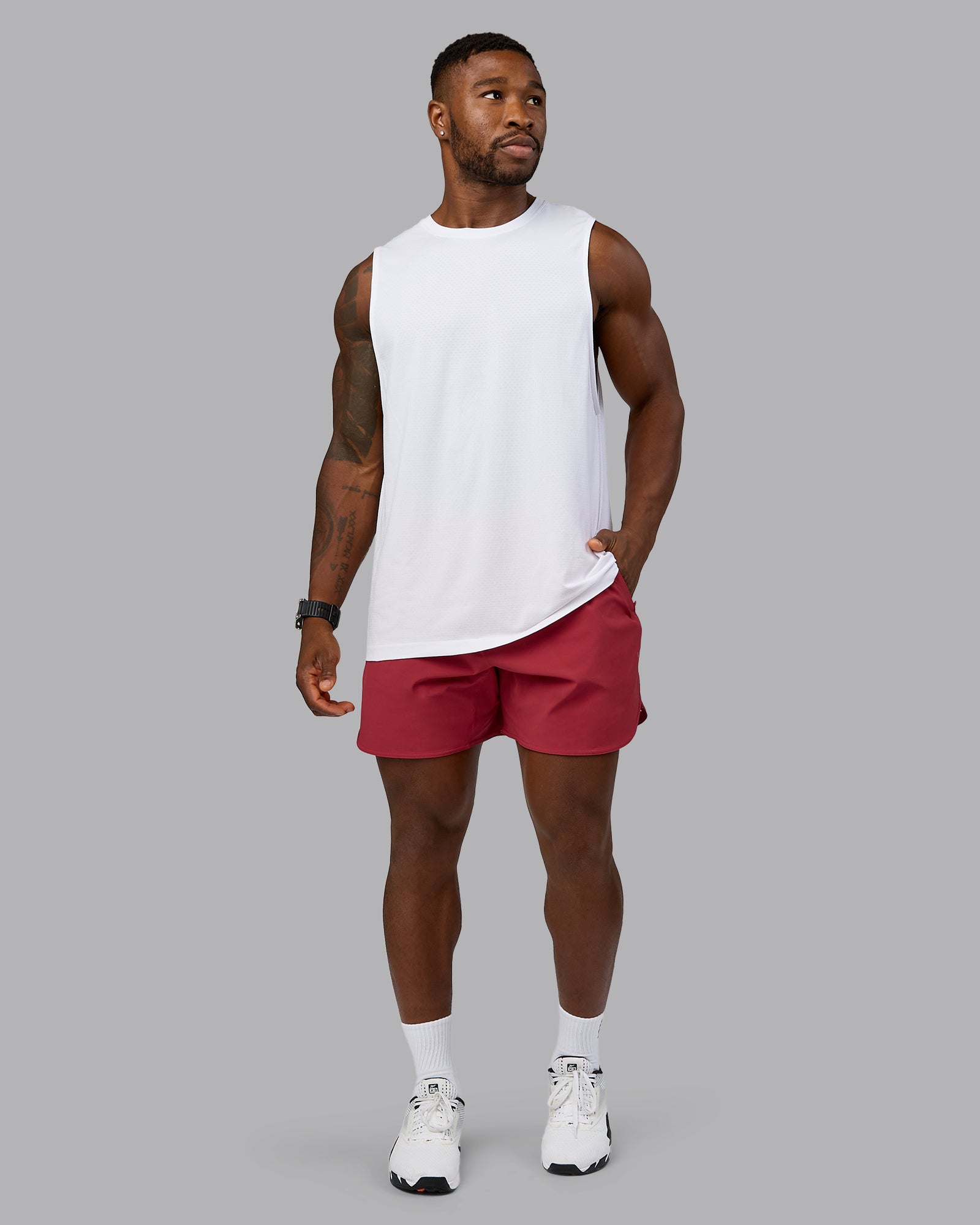 Model wearing AeroFLX+ Seamless Muscle Tank - White/White | Model:Sam | Size:L