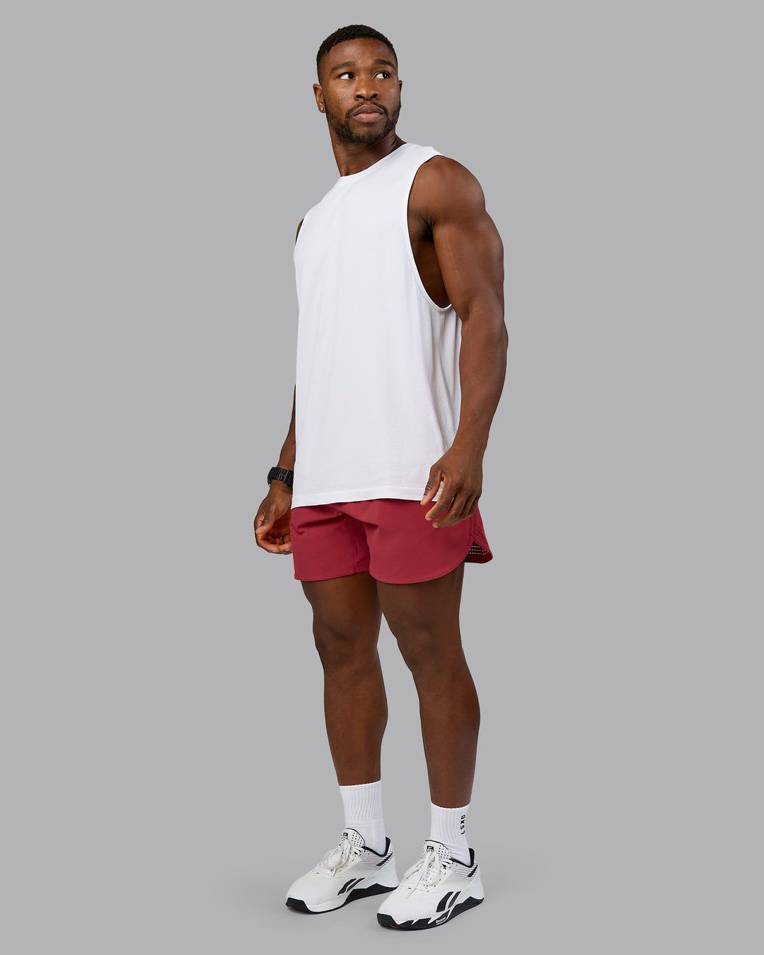 Model wearing AeroFLX+ Seamless Muscle Tank - White/White | Model:Sam | Size:L
