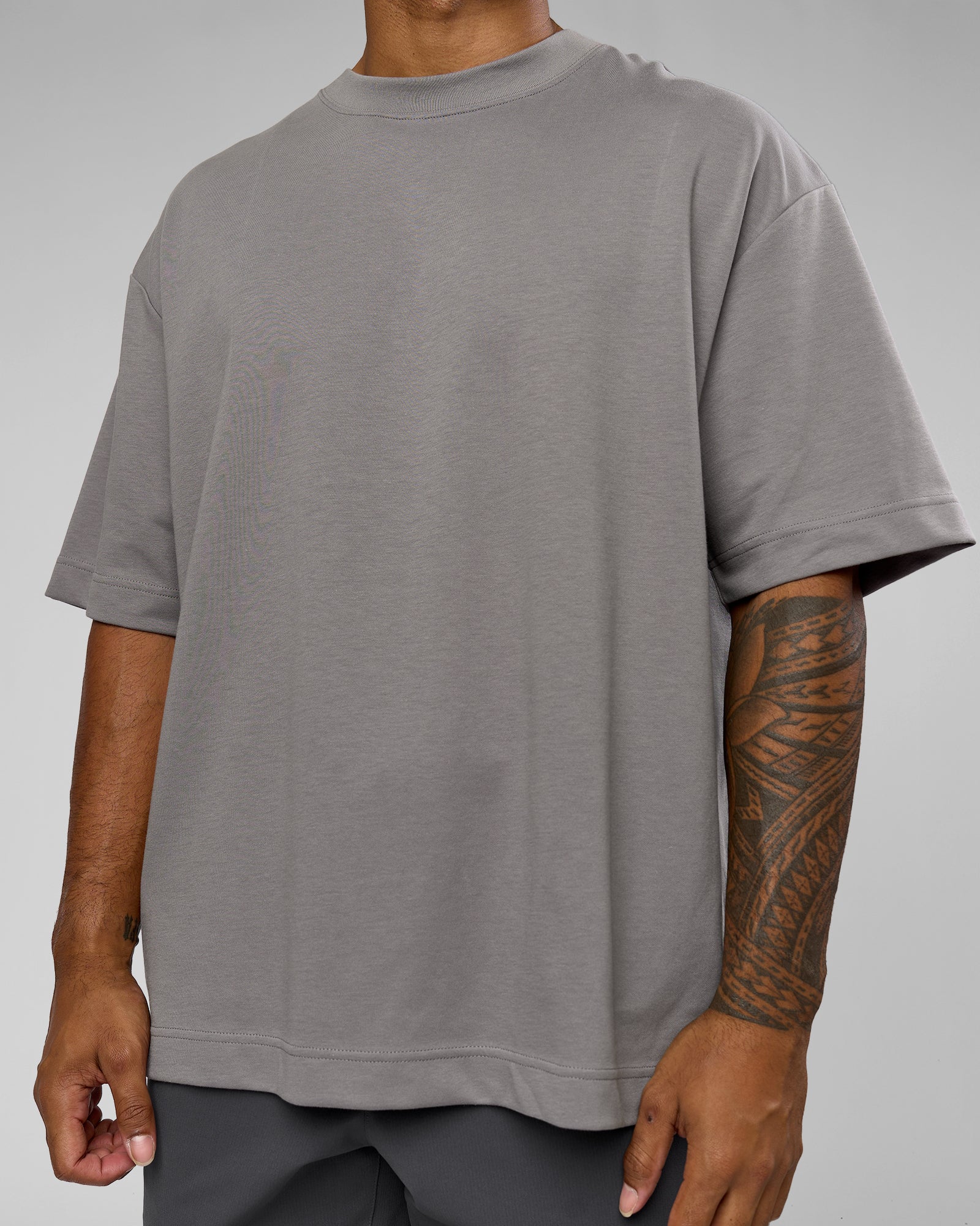 Man wearing AfterDark ZeroCrease Oversized Tee - Storm Front | Model:Xav | Size:L