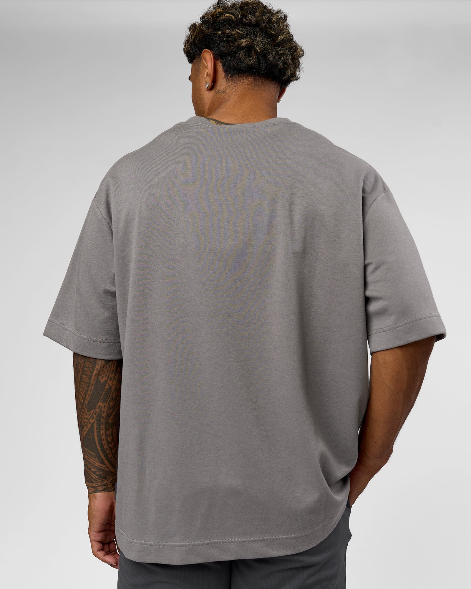 Man wearing AfterDark ZeroCrease Oversized Tee - Storm Front | Model:Xav | Size:L