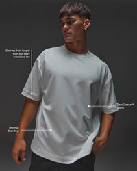 Man wearing AfterDark ZeroCrease Oversized Tee - White | Model:Mabyro | Size:M