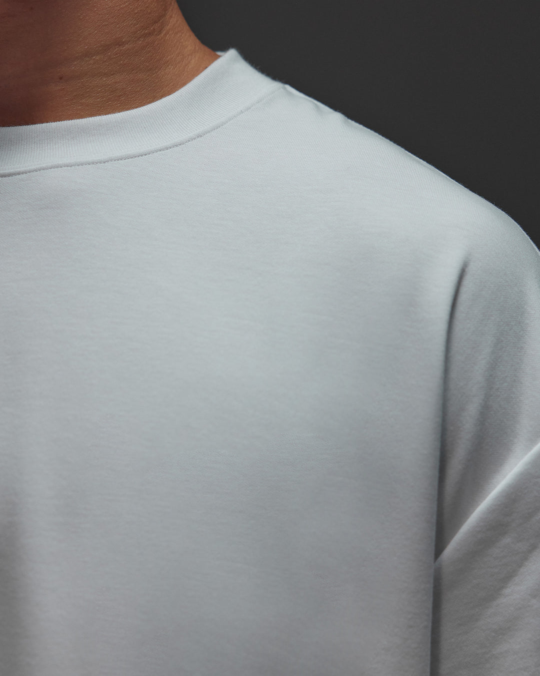 Man wearing AfterDark ZeroCrease Oversized Tee - White | Model:Jackson | Size:L