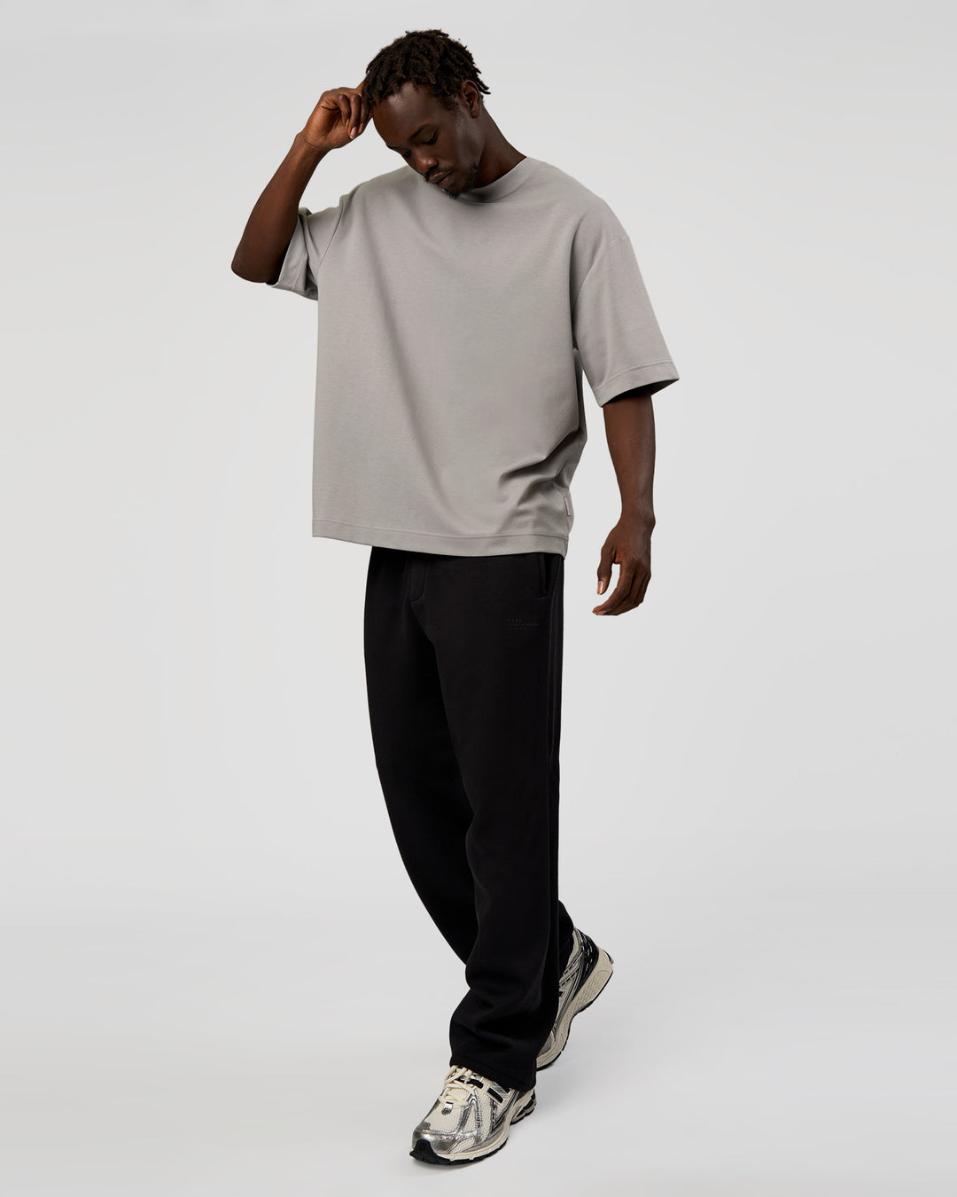 Man wearing AfterDark ZeroCrease Straight Leg Pant - Black | Model:Okello | Size:L