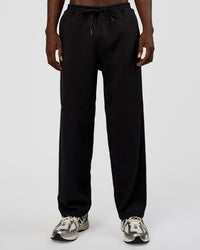 Man wearing AfterDark ZeroCrease Straight Leg Pant - Black | Model:Okello | Size:L