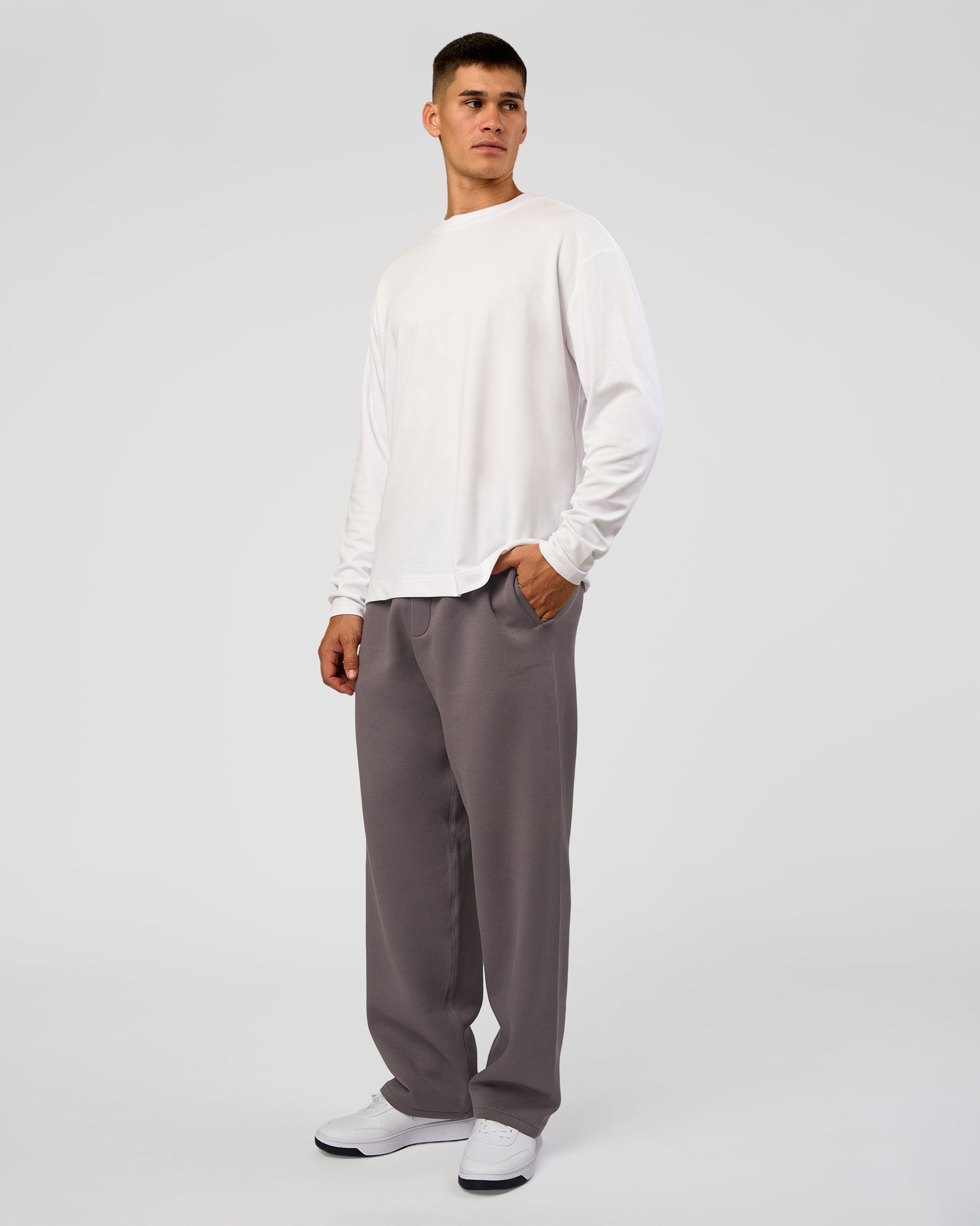 Man wearing AfterDark ZeroCrease Straight Leg Pant - Duskstone | Model:Jackson | Size:L