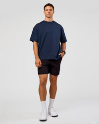 Man wearing All Day ZeroCrease™ Regular 8" Short - Black | Model:Liam | Size:34