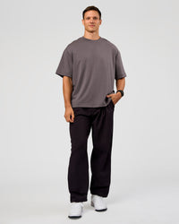 Man wearing All Day ZeroCrease™ Wide Leg Pant - Black | Model:Liam | Size:34