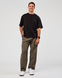 Man wearing All Day ZeroCrease™ Wide Leg Pant - Walnut Grey | Model:Liam | Size:L