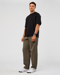 Man wearing All Day ZeroCrease™ Wide Leg Pant - Walnut Grey | Model:Liam | Size:L
