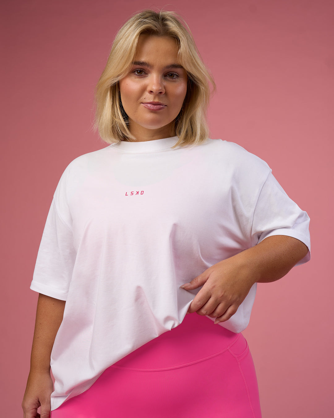 Woman wearing BCAM Go-To FLXCotton Oversized Tee - White-Ultra Pink | Model:Bianca | Size:L