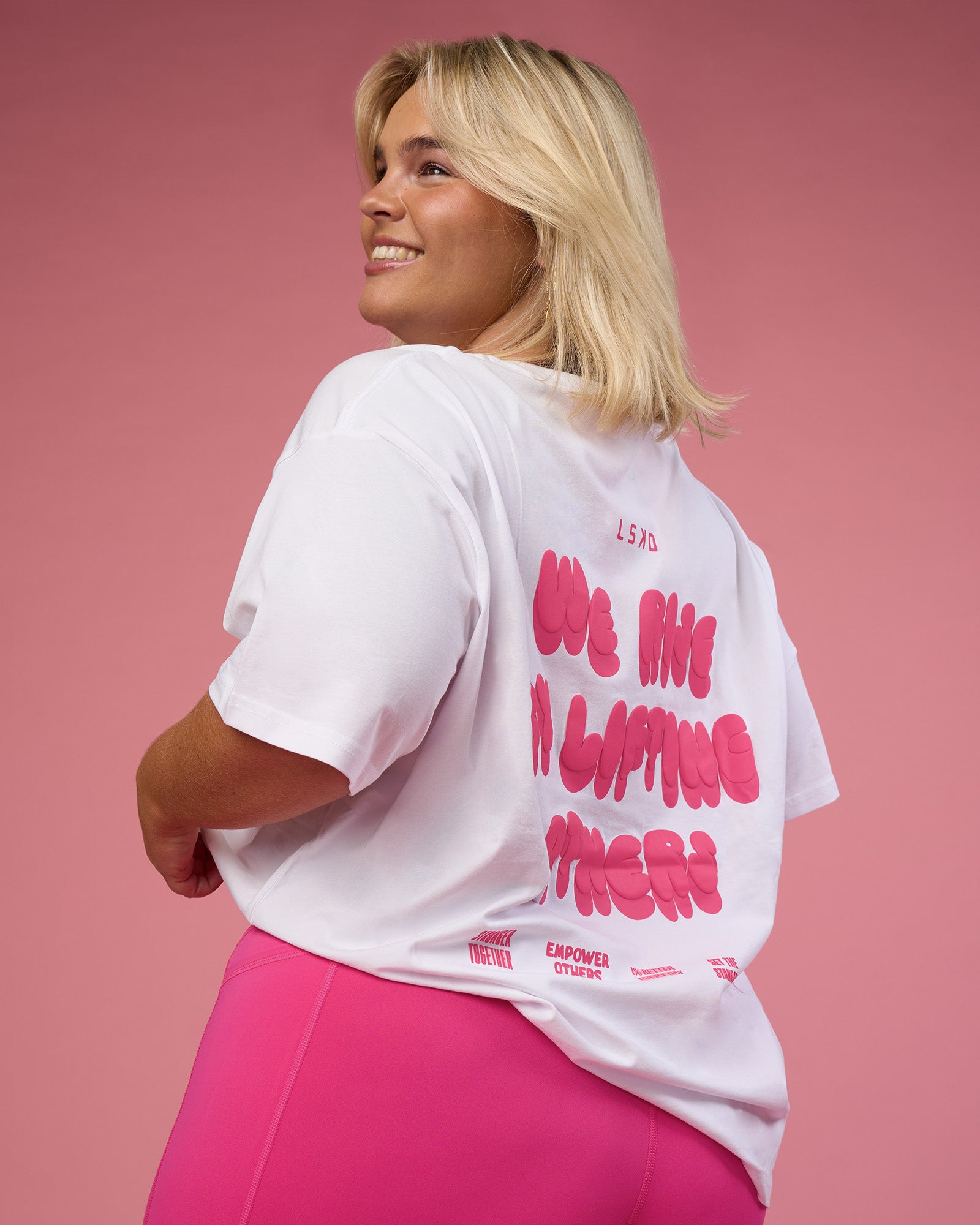 Woman wearing BCAM Go-To FLXCotton Oversized Tee - White-Ultra Pink | Model:Bianca | Size:L