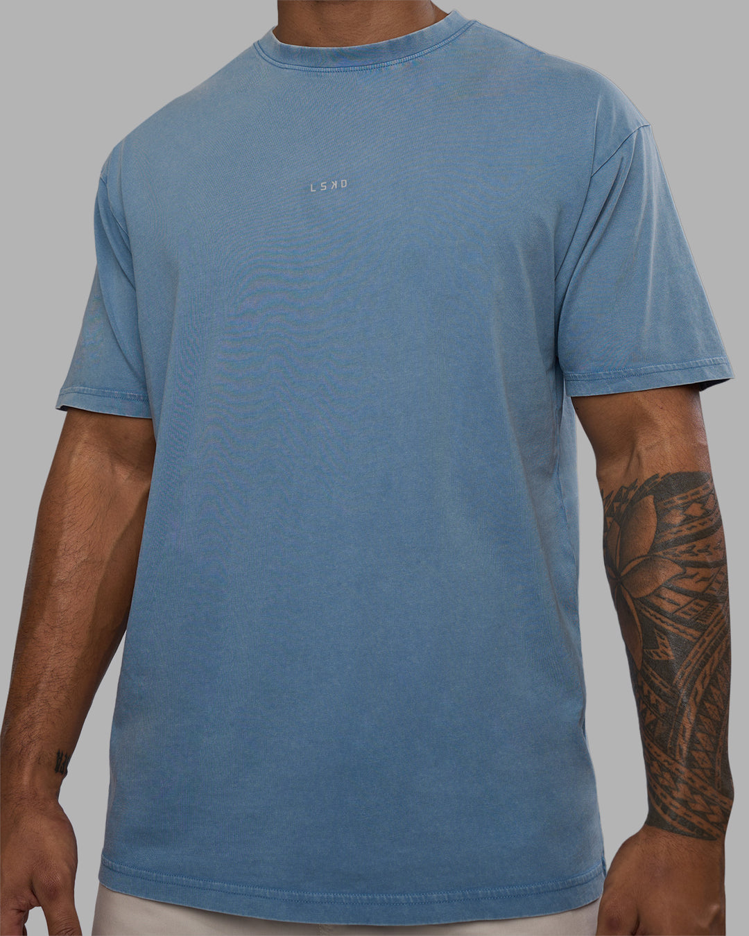 Man wearing Base FLXCotton Tee Oversized - Elemental Blue Washed | Model:Xav | Size:L
