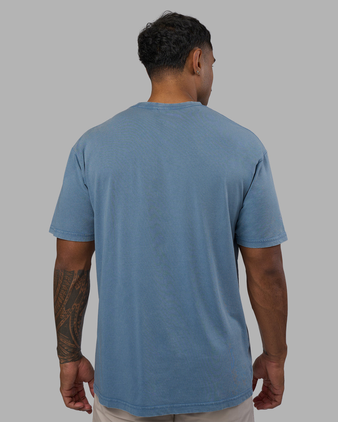 Man wearing Base FLXCotton Tee Oversized - Elemental Blue Washed | Model:Xav | Size:L