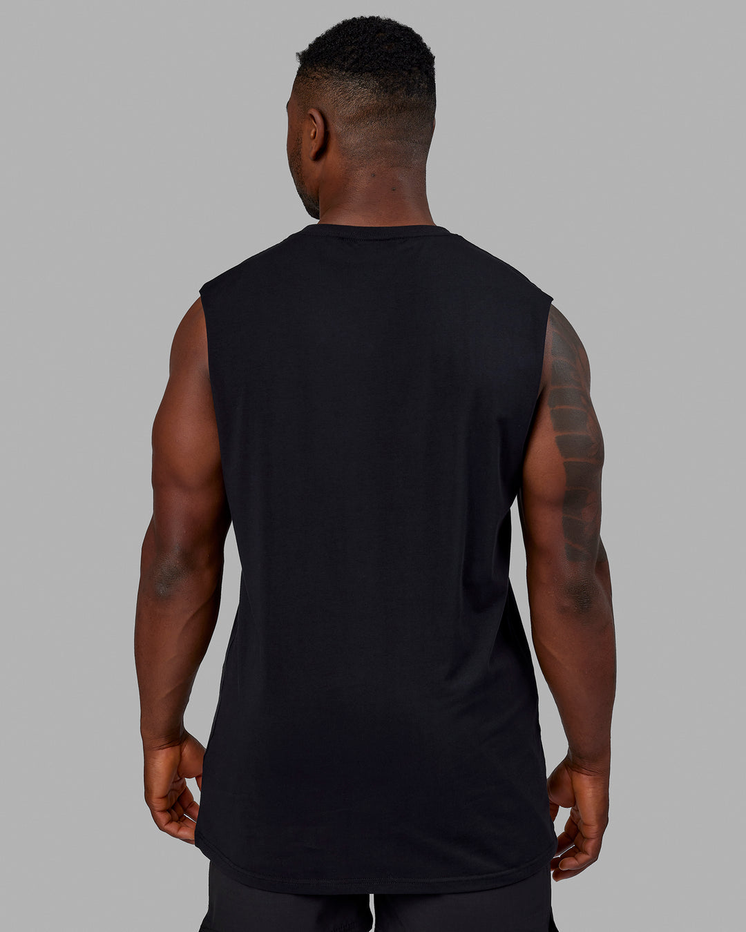 Man wearing Base FLXCotton Tank - Black | Model:Sam | Size:L