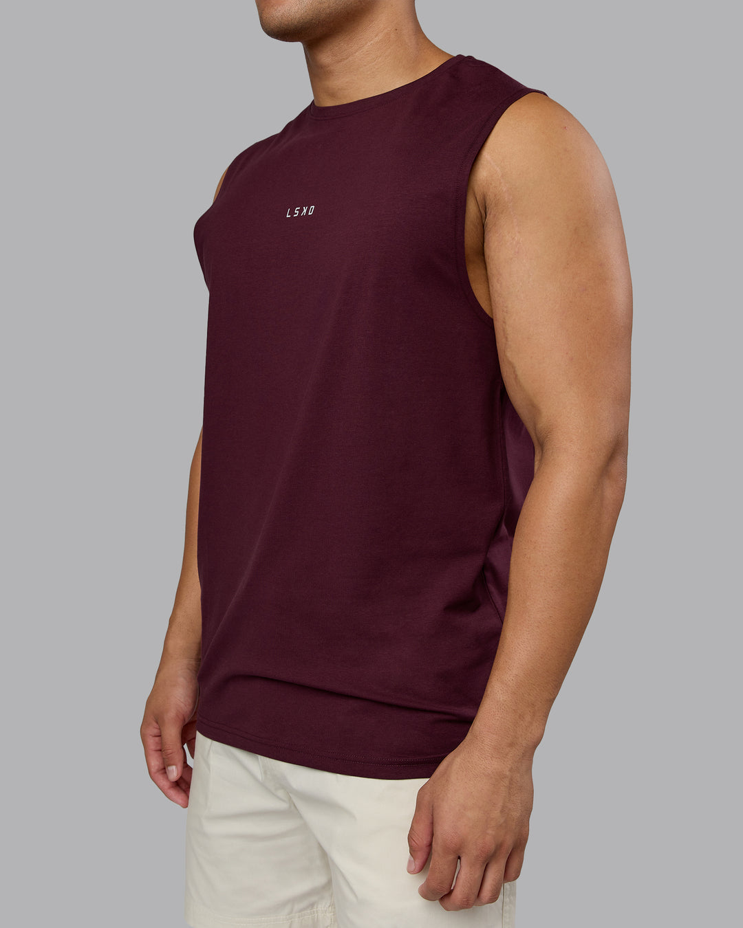 Man wearing Base FLXCotton Tank - Cherry Lacquer | Model:Kaelyb | Size:L
