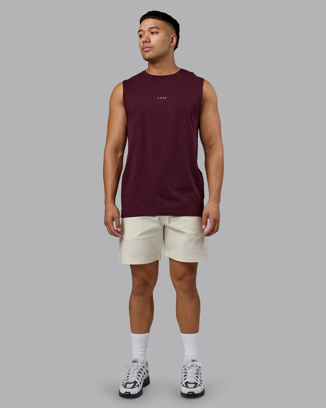 Man wearing Base FLXCotton Tank - Cherry Lacquer | Model:Kaelyb | Size:L