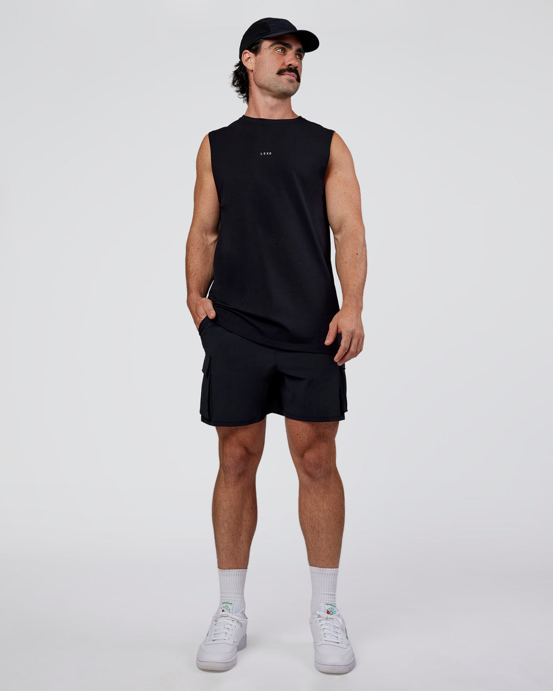 Man wearing Base FLXCotton Tank Regular Fit +2cm - Black | Model:Adam | Size:L