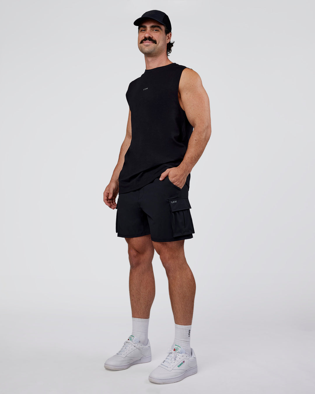 Man wearing Base FLXCotton Tank Regular Fit +2cm - Black | Model:Adam | Size:L