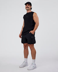 Man wearing Base FLXCotton Tank Regular Fit +2cm - Black | Model:Adam | Size:L