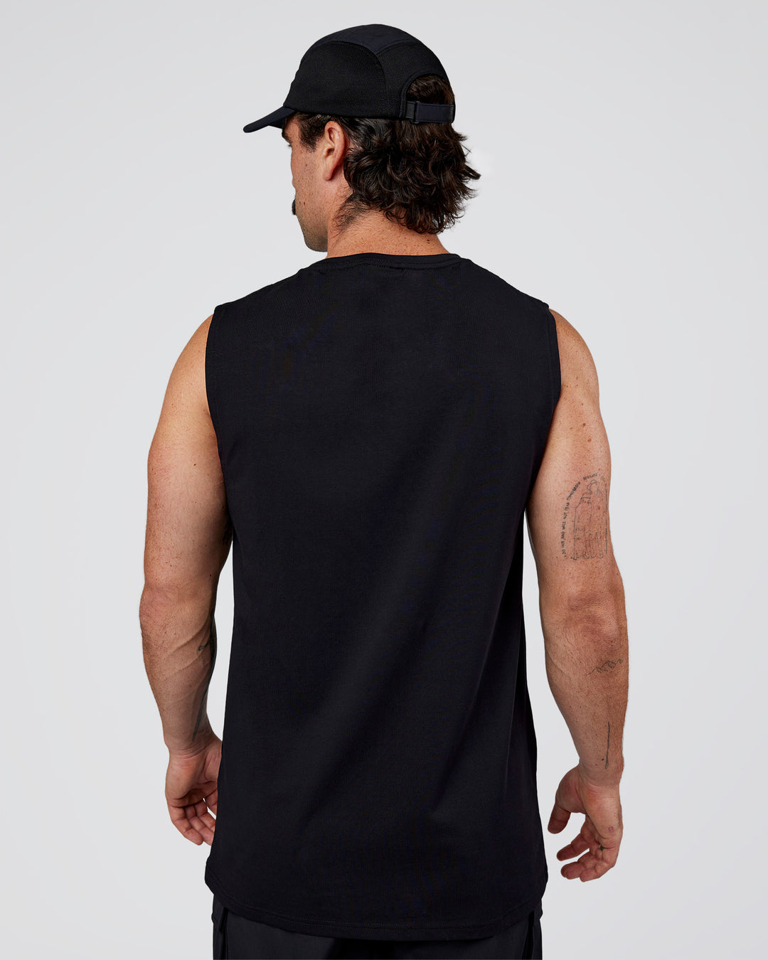 Man wearing Base FLXCotton Tank Regular Fit +2cm - Black | Model:Adam | Size:L