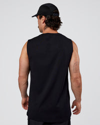 Man wearing Base FLXCotton Tank Regular Fit +2cm - Black | Model:Adam | Size:L