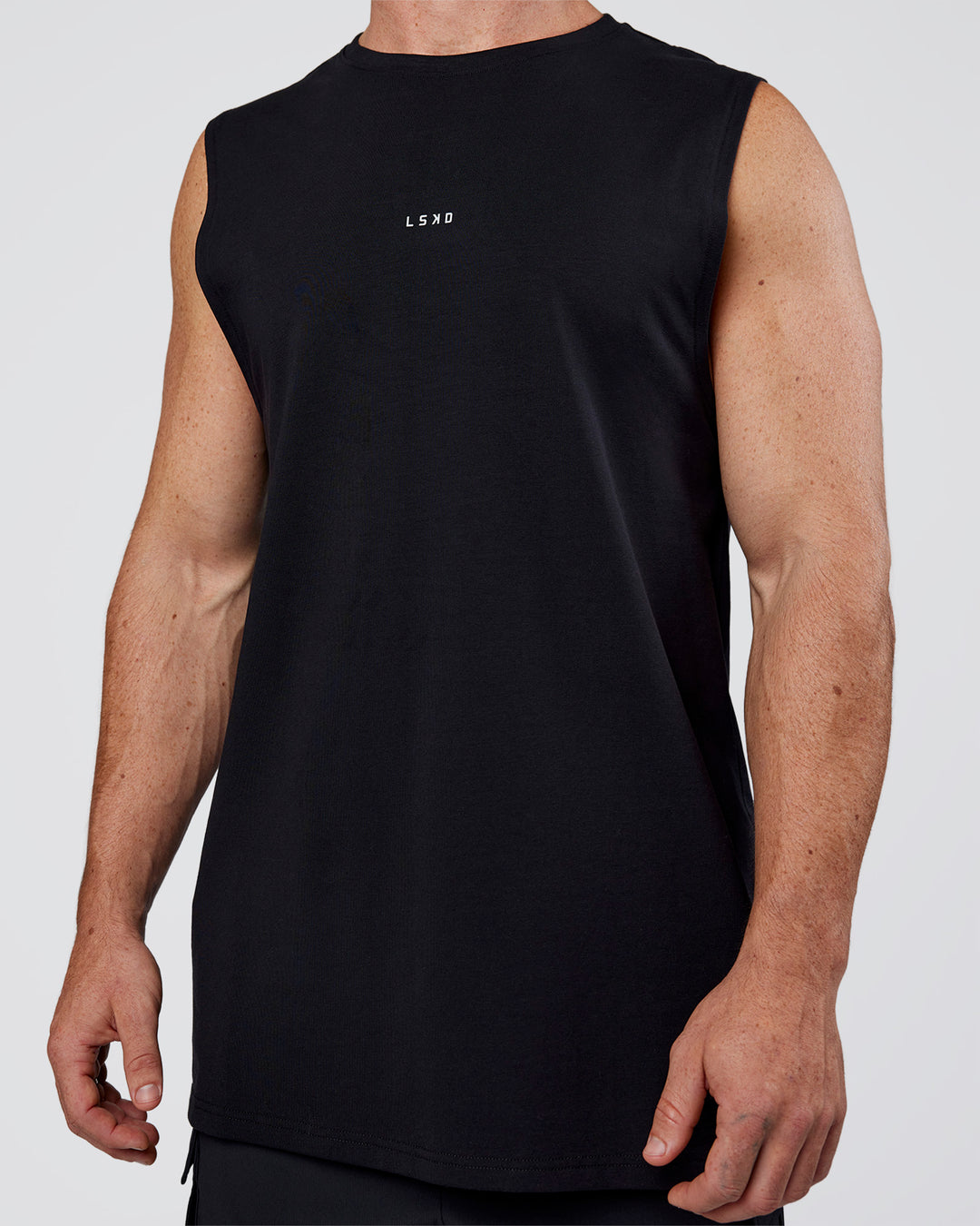 Man wearing Base FLXCotton Tank Regular Fit +2cm - Black | Model:Adam | Size:L