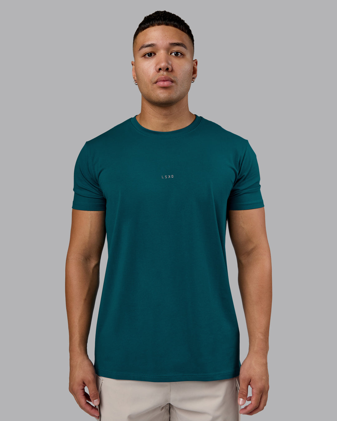 Man wearing Base FLXCotton Tee - Blue Coral | Model:Kaelyb | Size:L