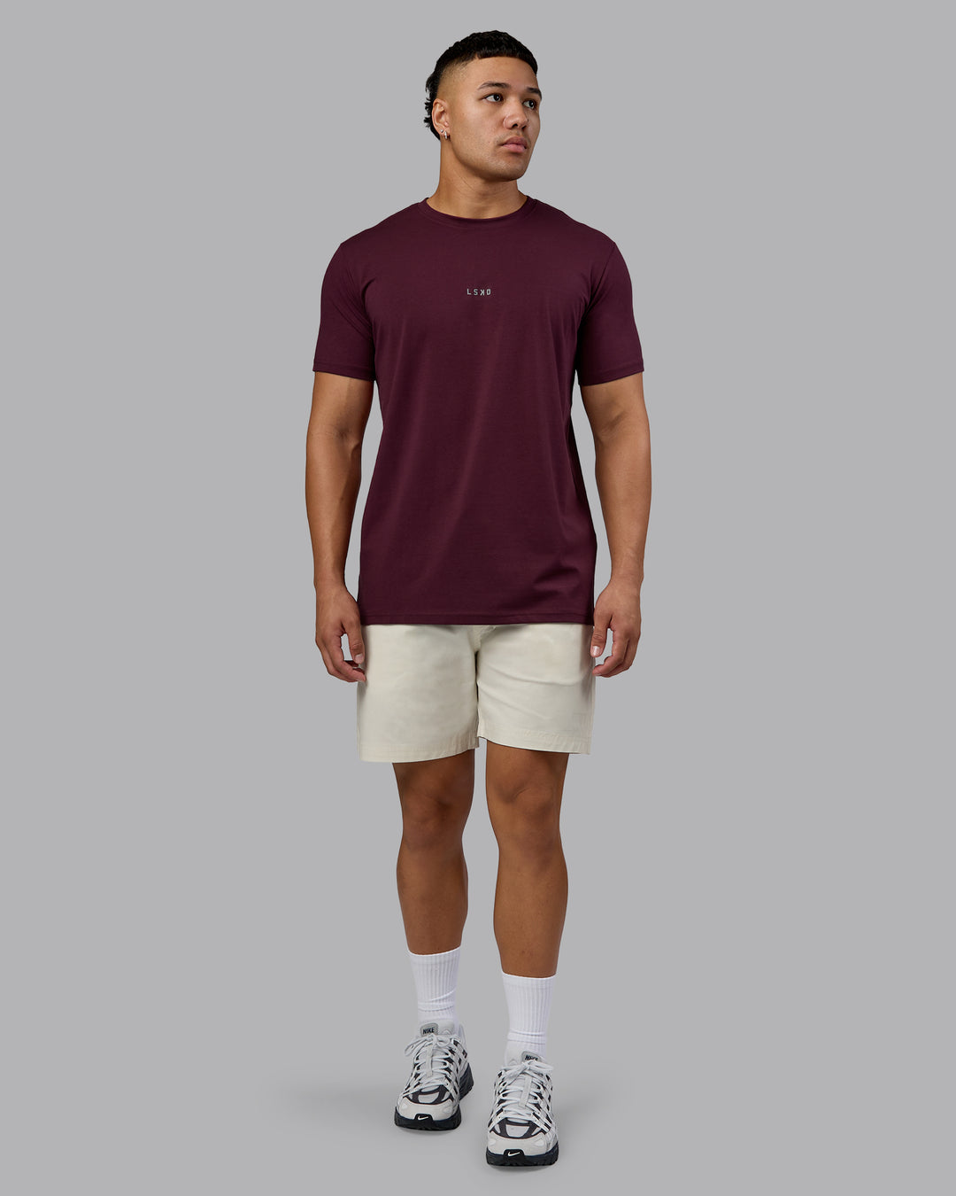 Man wearing Base FLXCotton Tee - Cherry Lacquer | Model:Kaelyb | Size:L