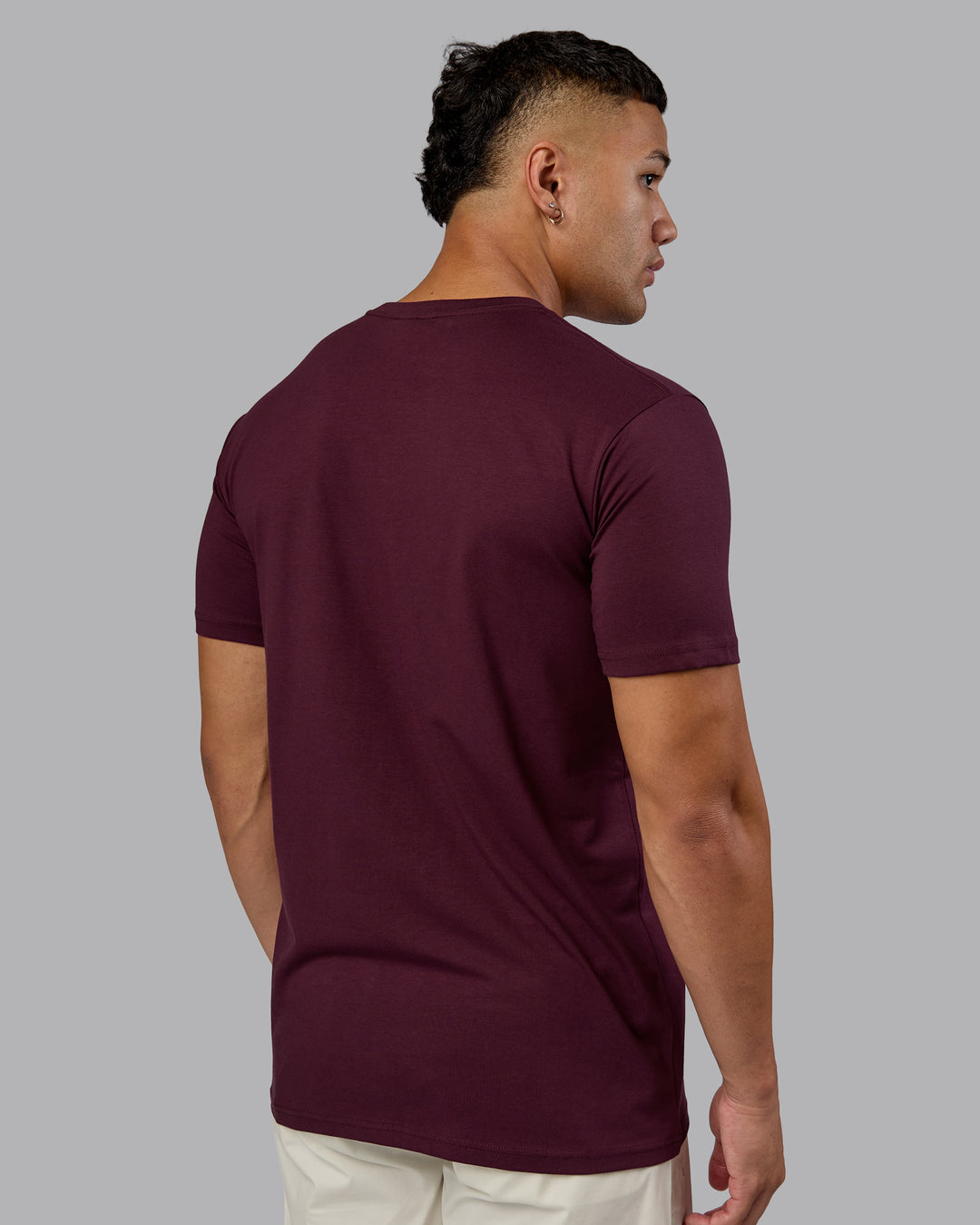 Man wearing Base FLXCotton Tee - Cherry Lacquer | Model:Kaelyb | Size:L