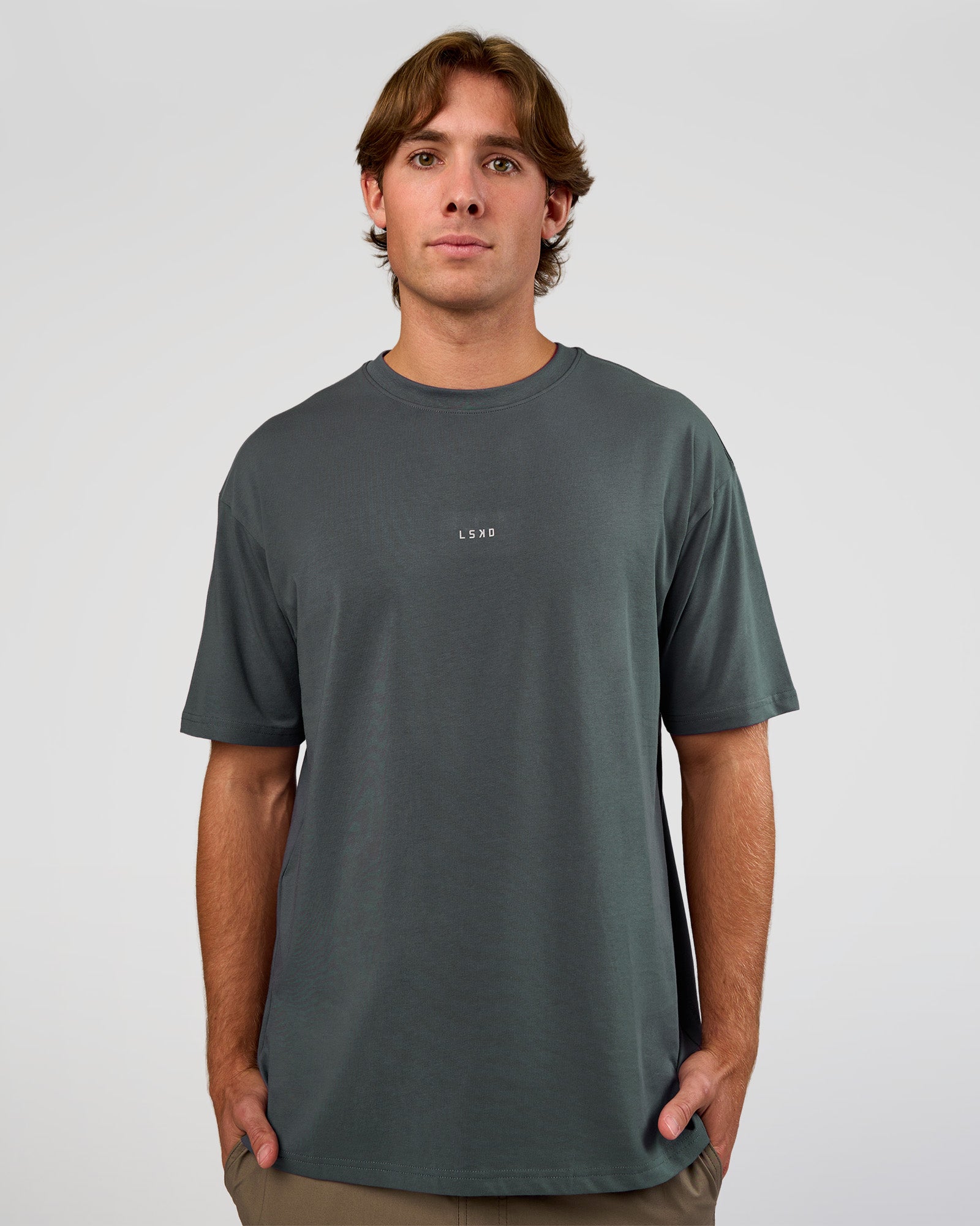 Man wearing Base FLXCotton Tee Oversized - Dark Slate | Model:Marcus | Size:L