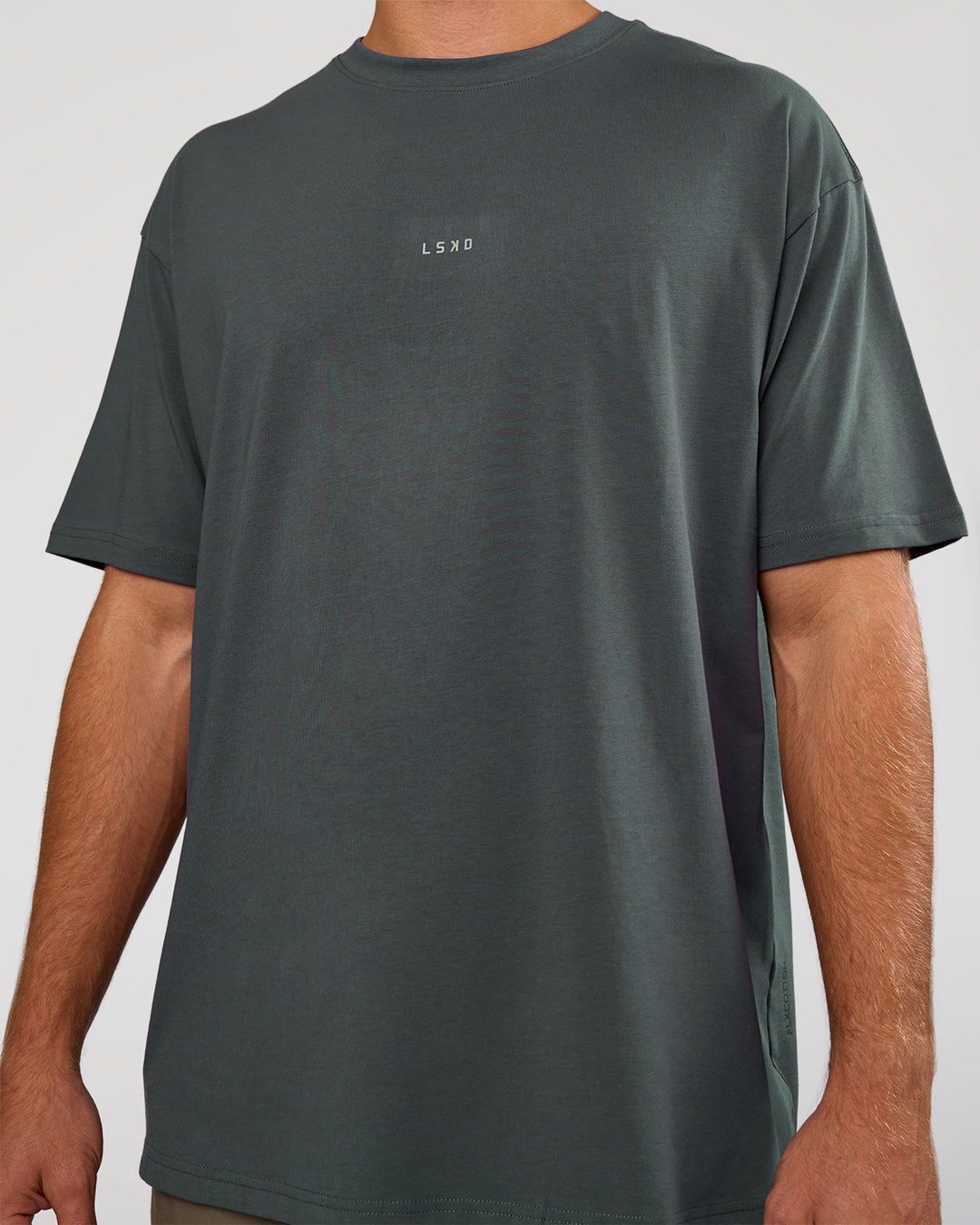 Man wearing Base FLXCotton Tee Oversized - Dark Slate | Model:Marcus | Size:L