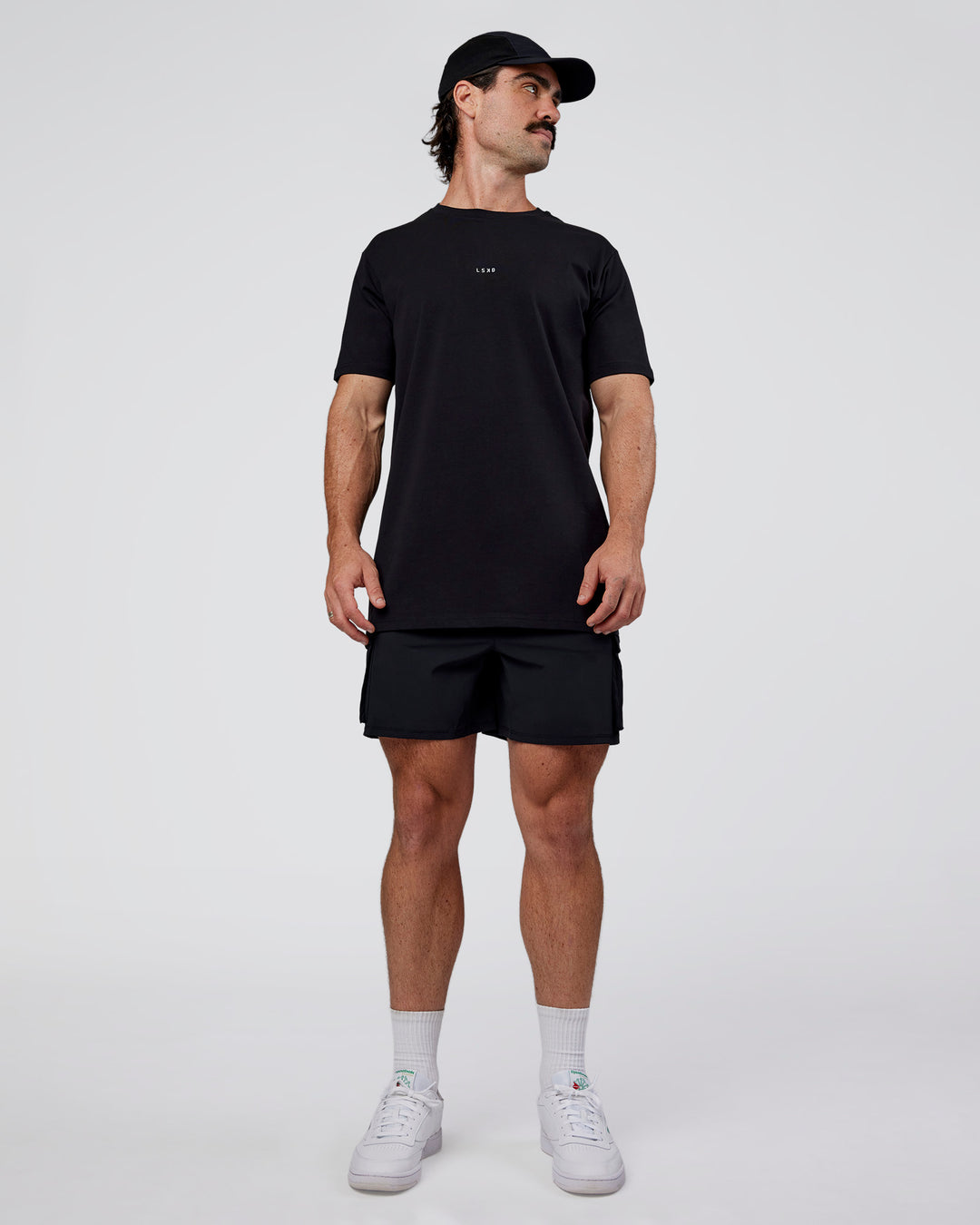 Man wearing Base FLXCotton Tee  Regular Fit +2cm - Black | Model:Adam | Size:L