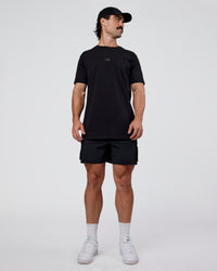 Man wearing Base FLXCotton Tee  Regular Fit +2cm - Black | Model:Adam | Size:L