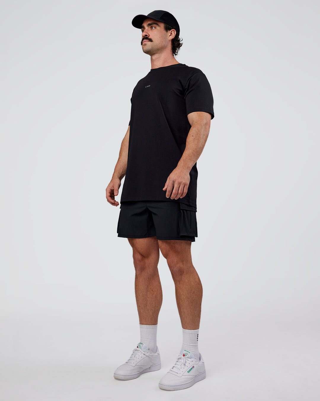 Man wearing Base FLXCotton Tee  Regular Fit +2cm - Black | Model:Adam | Size:L